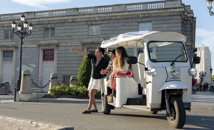 Private tuk-tuk in front of the Royal Palace, Madrid